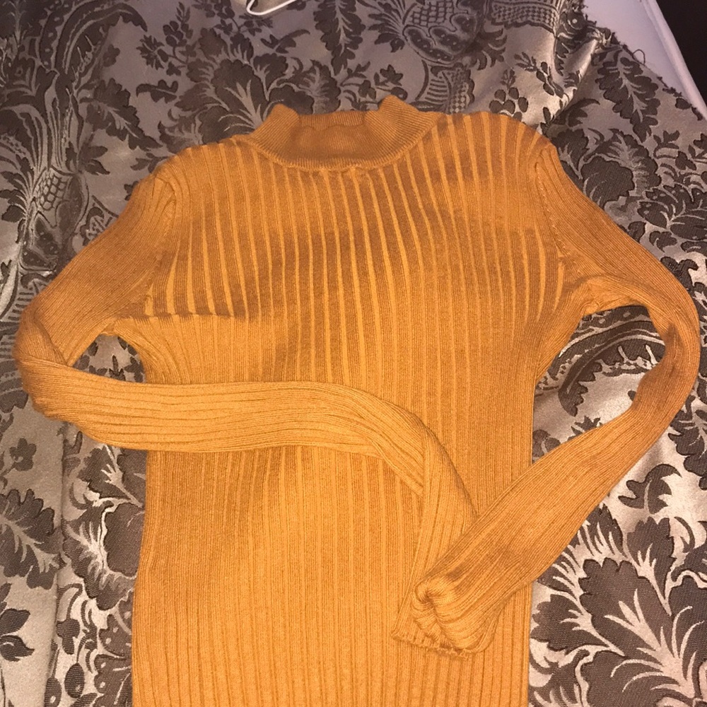 Skin tight mustard sweater.